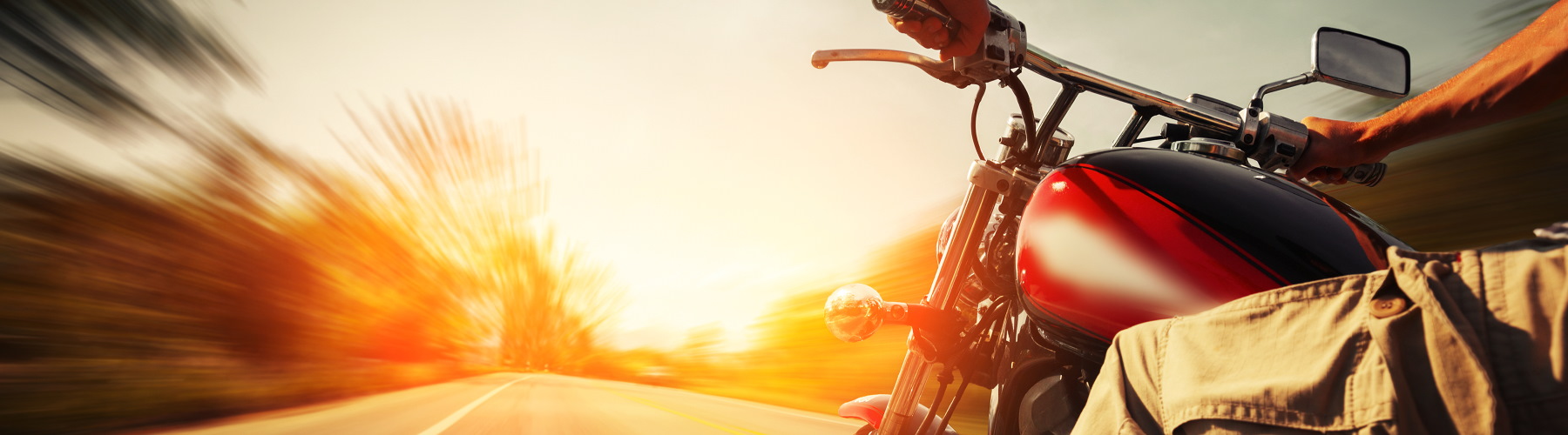 close up of motorcycle driving on highway