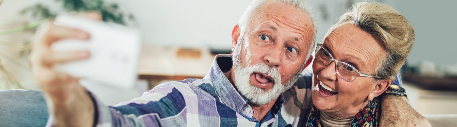older couple taking a selfie